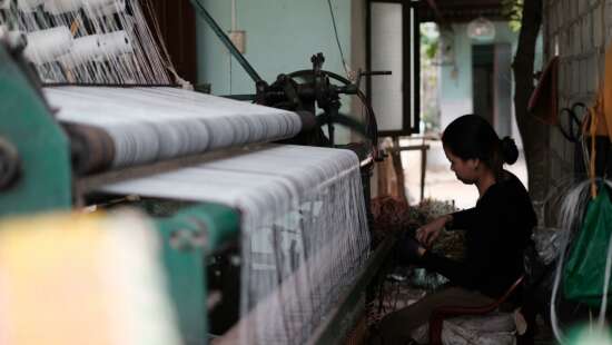 Woman working on a textile machine 2892373